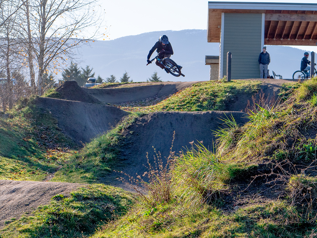 Cyclist jumping on a downhill run at the Steve Smith Bike Park