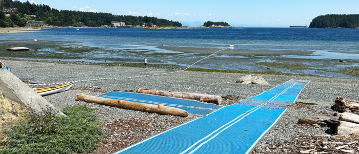 Departure Bay MobiMat A blue Mobimat leading to the water at Departure Bay at low tide