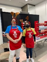 Youth leaders at a holiday wrapping station