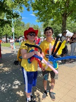 Leaders in Training at the Canada Day Celebration holding balloon animals